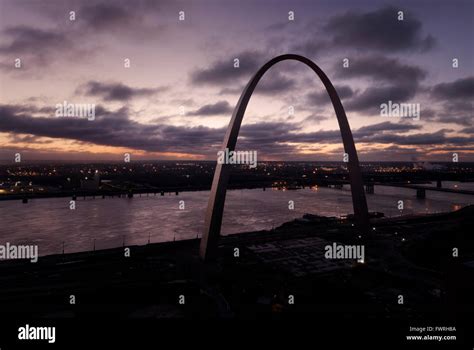 Aerial view of the Gateway Arch in front of the Mississippi River at dawn in St. Louis, Missouri ...