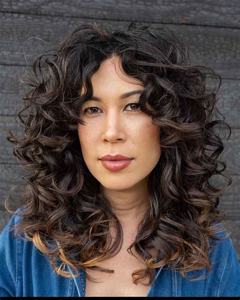 21 Best Ways To Get Curtain Bangs For Curly Hair Right Now