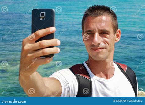 Portrait Of Young Man Taking Selfie By Cell, Mobile Phone , Smartphone On Beach Near Sea, Ocean ...