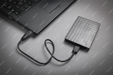 Premium Photo | External hard drive connection on a laptop.