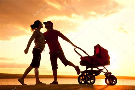 Happy family walking on sunset — Stock Photo © yanlev #25009359