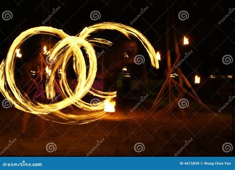 Fire Dancer Silhouette On Sunset Sky Background Stock Image ...