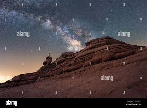 Low angle of traveler standing Balanced Rock formation located against ...