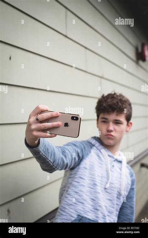 Teenage boy taking a selfie with his new iPhone X Stock Photo - Alamy