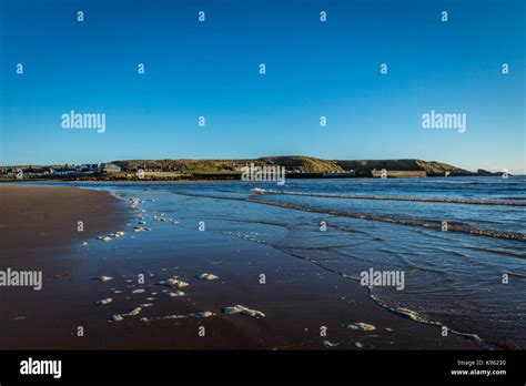 Cruden Bay beach and harbour Stock Photo - Alamy