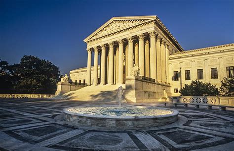 Sun shining on the Supreme Court building at sunset, Washington, DC ...