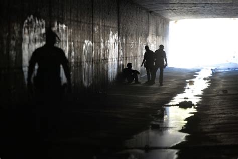 Into the dark: Officers scour tunnels, flood channels to warn homeless ...