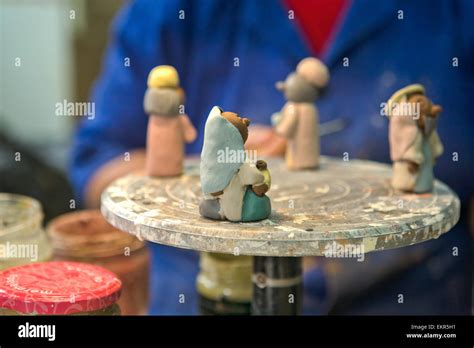 Painting Handmade Clay Sculpture In The Pottery Workshop Stock Photo - Alamy