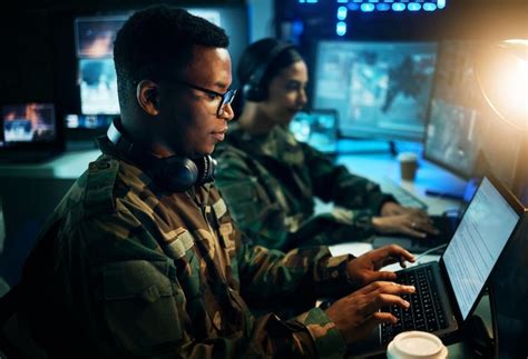 Premium Photo | Military control room computer and soldier at desk ...