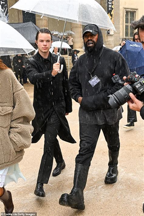 Kanye West sports mystery marks on his face and a Balenciaga mouth guard at Givenchy show during ...