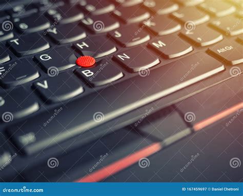 A Close-up Photo of the Red Pointing Stick of on a Laptop Keyboard Stock Image - Image of black ...