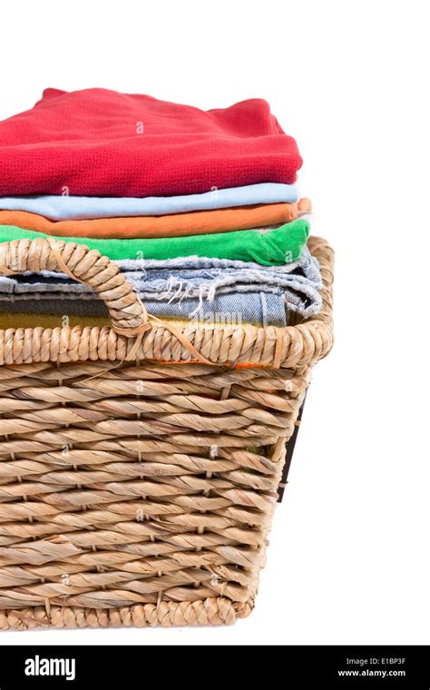 Wicker basket of clean fresh laundry filled with neatly folded clean ...