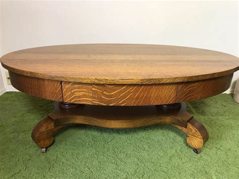 Vintage Tiger Oak Oval Coffee Table With Long Drawer And Casters 44W X 27D X 16.5H