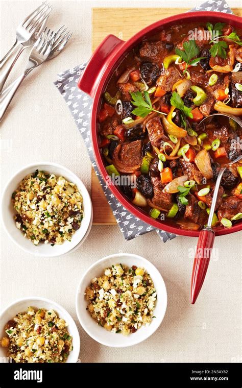 Beef Tagine stew served with bowls of couscous Stock Photo - Alamy