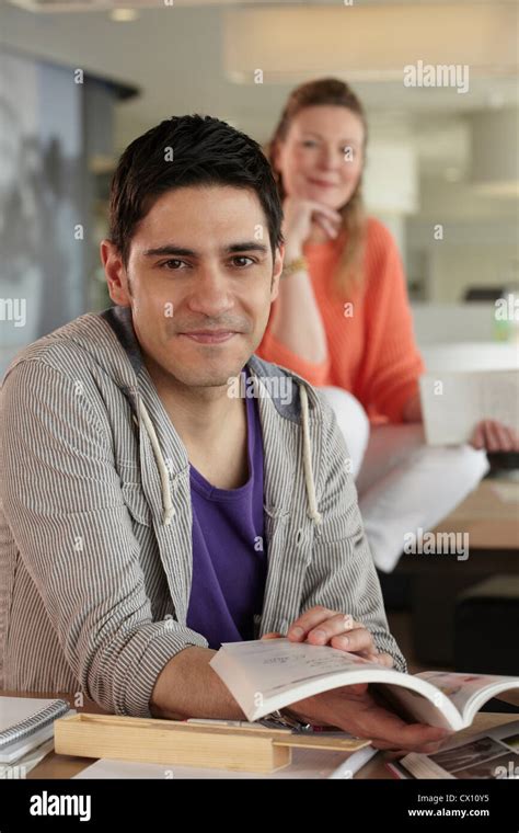 Man holding book, portrait Stock Photo - Alamy