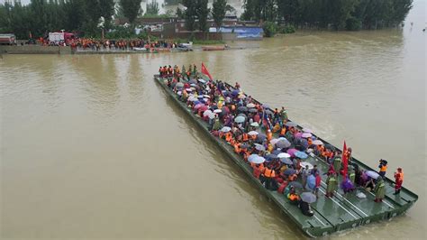 China sends supplies, rebuilds barriers in area where floods killed at ...