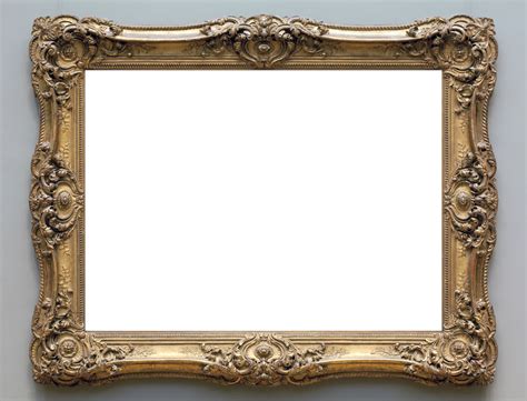 an ornate gold framed mirror hanging on the wall with a white ...