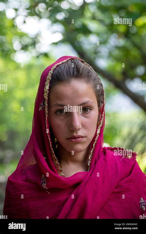 Portrait of a young Pashtun girl with red headscarf, Bumburet Valley ...