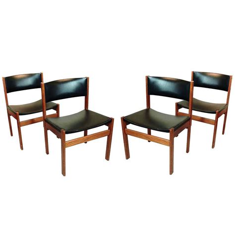 Set of Four Danish Mid-Century Modern Teak and Leather Dining Chairs For Sale at 1stdibs