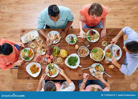 Group of People Eating at Table with Food Stock Photo - Image of meal, glass: 110942010