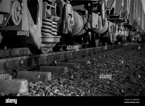 Grayscale closeup of train wheels Stock Photo - Alamy