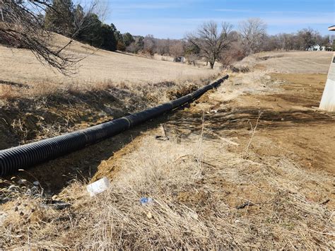 18 inches by 20 feet corrugated culvert pipe with a total of 10 pipes project from tractor ...