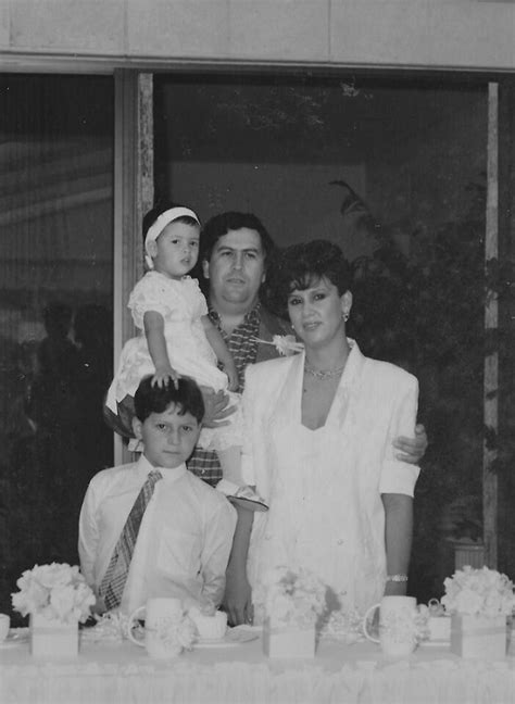 Escobar's family photo; Pablo Escobar holding Manuela, tugging on her ...