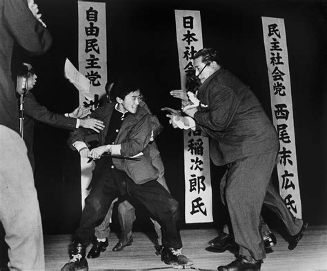 Using a traditional blade, 17-year-old Yamaguchi assassinates politician Asanuma in Tokyo, 1960