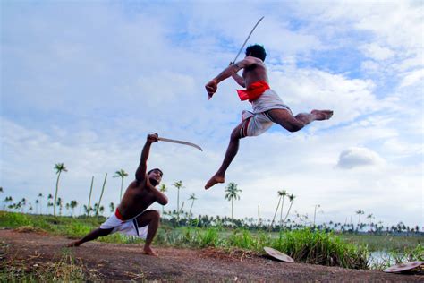 Two Man in White Shorts Fighting Using Sword during Daytime · Free Stock Photo