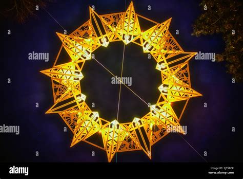 Symmetric yellow star (tetradecagonYellow star (tetradecagon or fourteen sided polygon) made of ...