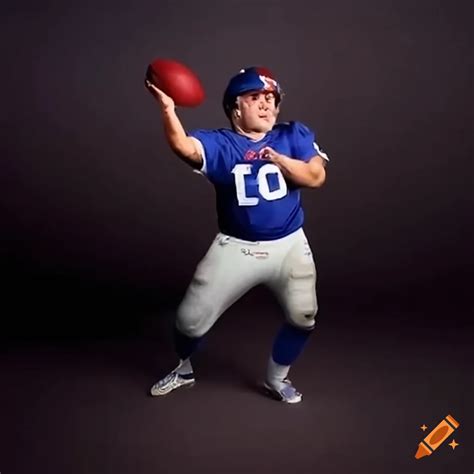 Danny devito in new york giants jersey throwing football