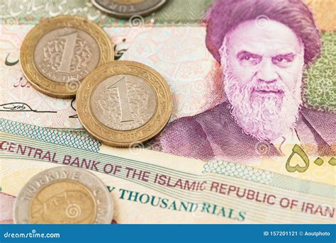 Turkish Lira Coins on Iranian Rial Currency Banknotes. Stock Image ...