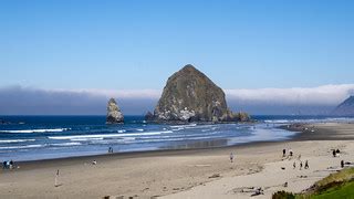Haystack Rock, Cannon Beach, with the Tillamook Light just… | Flickr