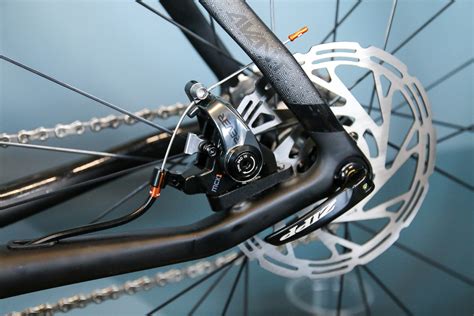 Rever brings flat mount to their dual piston mechanical disc brakes - Bikerumor