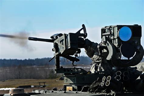 A U.S. soldier fires an MK-19 grenade launcher during a live-fire ...