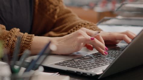 Close up of woman typing on laptop keyboard to work 4439922 Stock Video at Vecteezy