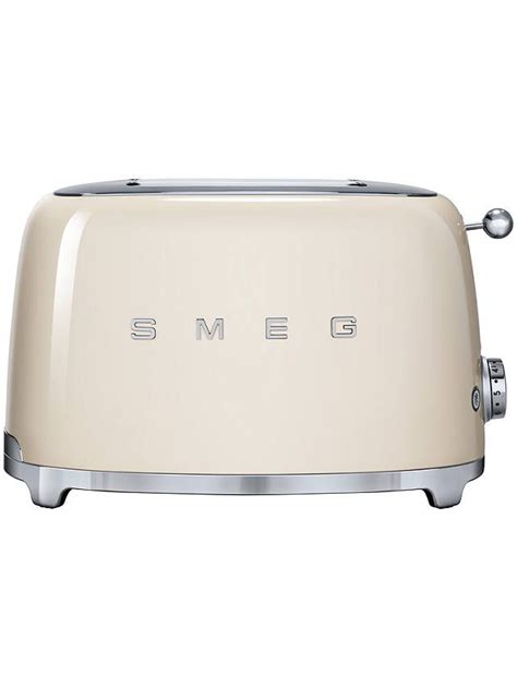 a cream colored toaster with the word smeg on it