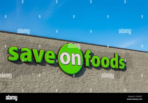 Save On Foods Logo against blue sky. Save On Foods is a large grocery store chain in Western ...