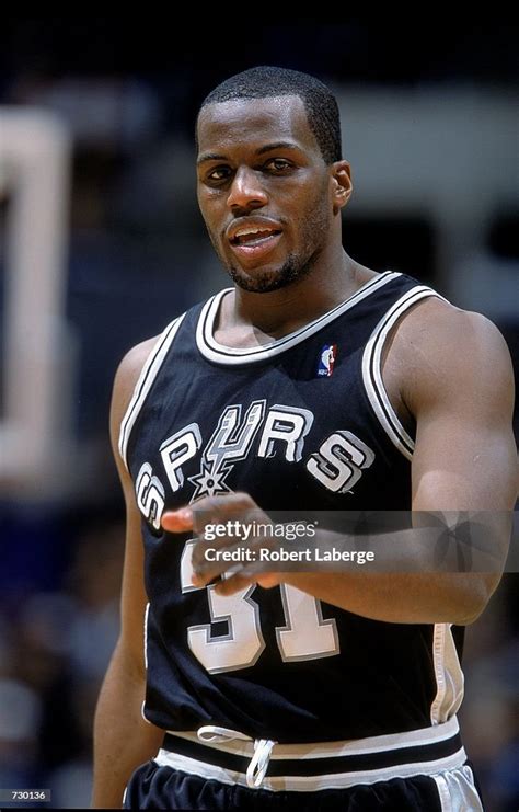 Malik Rose of the San Antonio Spurs walks on the court during the ...