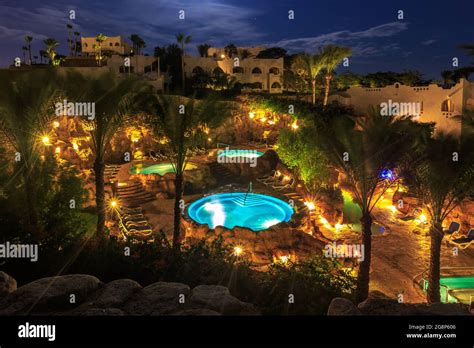 Evening view for luxury swimming pools in night illumination Stock ...