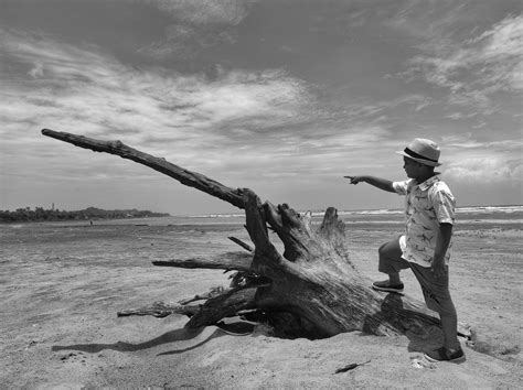 A Boy Standing on a Beach · Free Stock Photo