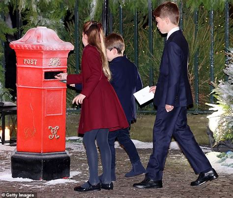 Prince George, Princess Charlotte and Prince Louis arrive at Kate's carol concert carrying ...