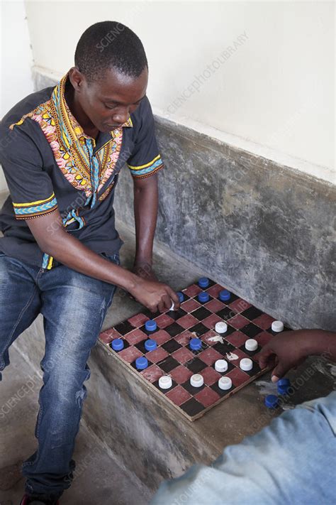 Draughts board game - Stock Image - C041/0344 - Science Photo Library