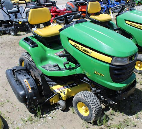 John Deere X300 Riding Mower - T.H.E. Company