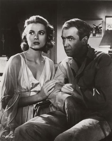 Grace Kelly and James Stewart in Rear window directed by Alfred Hitchcock, 1954 b - Flashbak