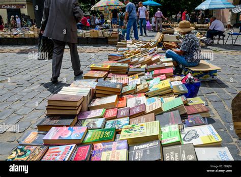 Woman selling books at antique and used books market in Lviv, Ukraine ...