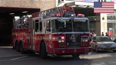 FDNY Ladder 4 fire truck responding with siren and lights - YouTube