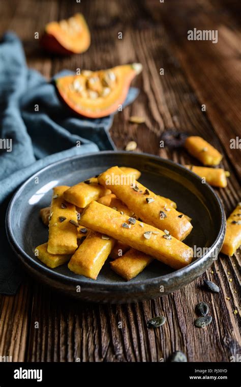 Salty Hokkaido pumpkin crackers topped with seeds Stock Photo - Alamy