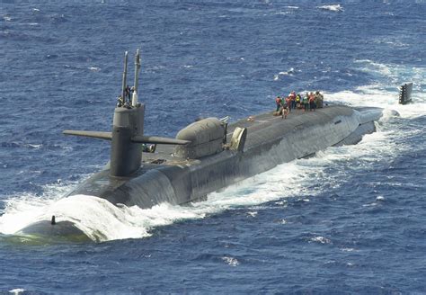 Marines assemble a combat rubber raiding craft aboard USS Ohio (SSGN 726). : r/submarines