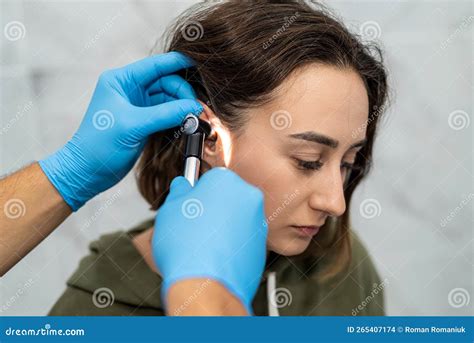 Advanced Examination of a Woman& X27;s Ear Using an Otoscope at a Doctor& X27;s Appointment ...